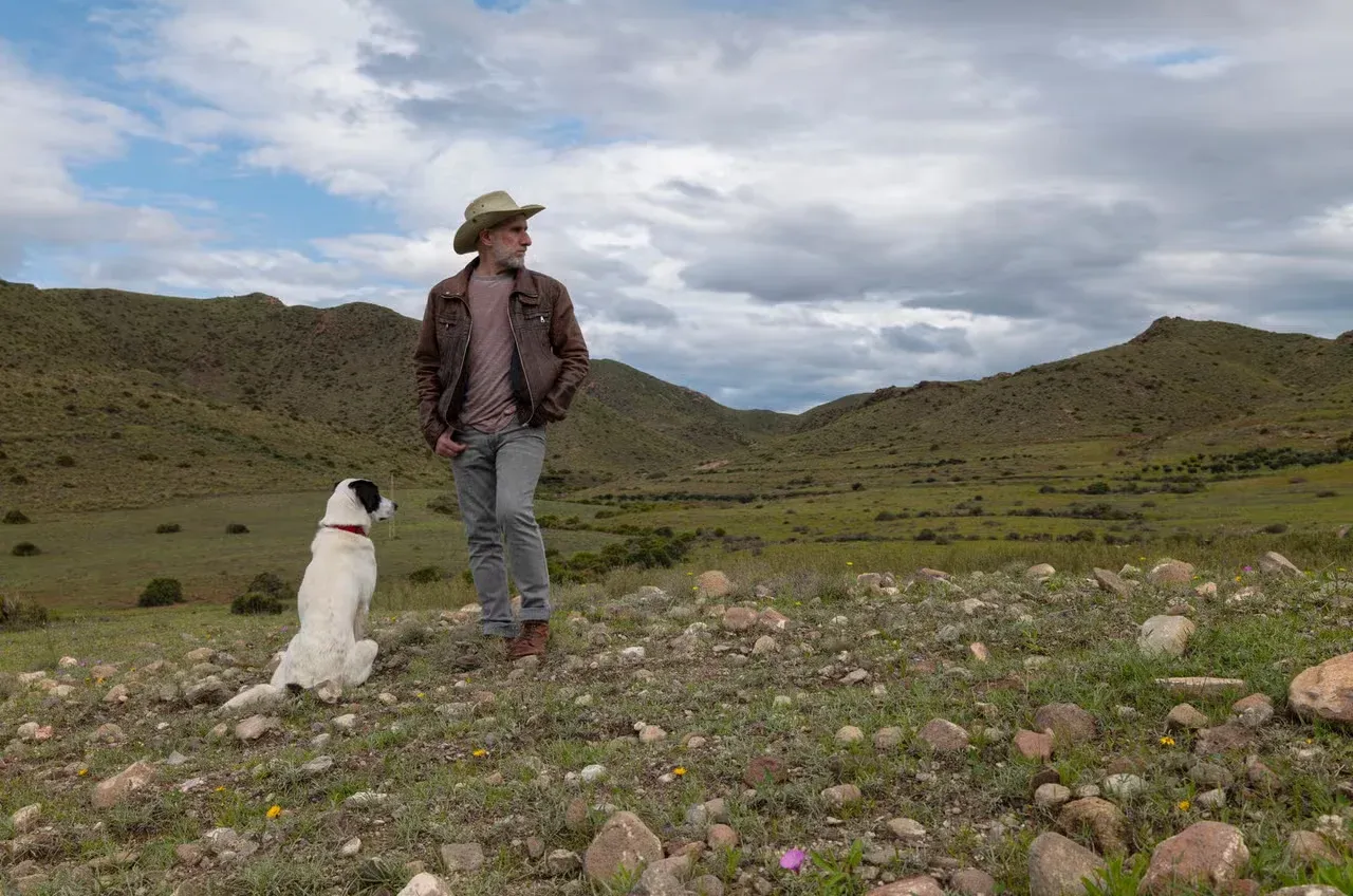 A cowboy and his dog with a western-style name.