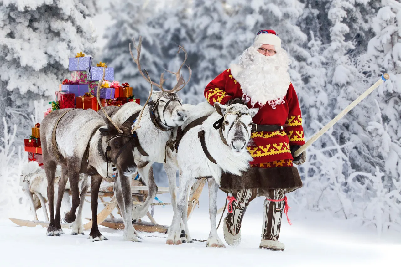Santa Claus with his reindeer.