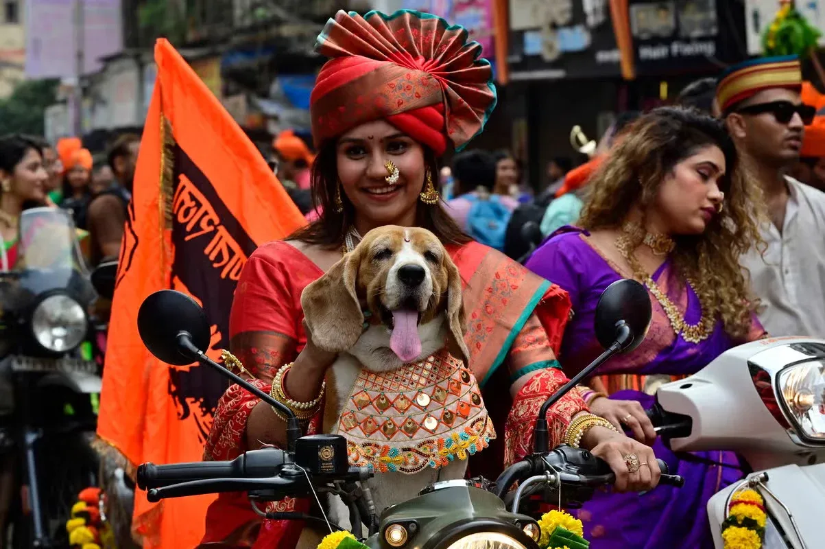 A woman and her dog celebrating Gudi Padwa in Mumbai.